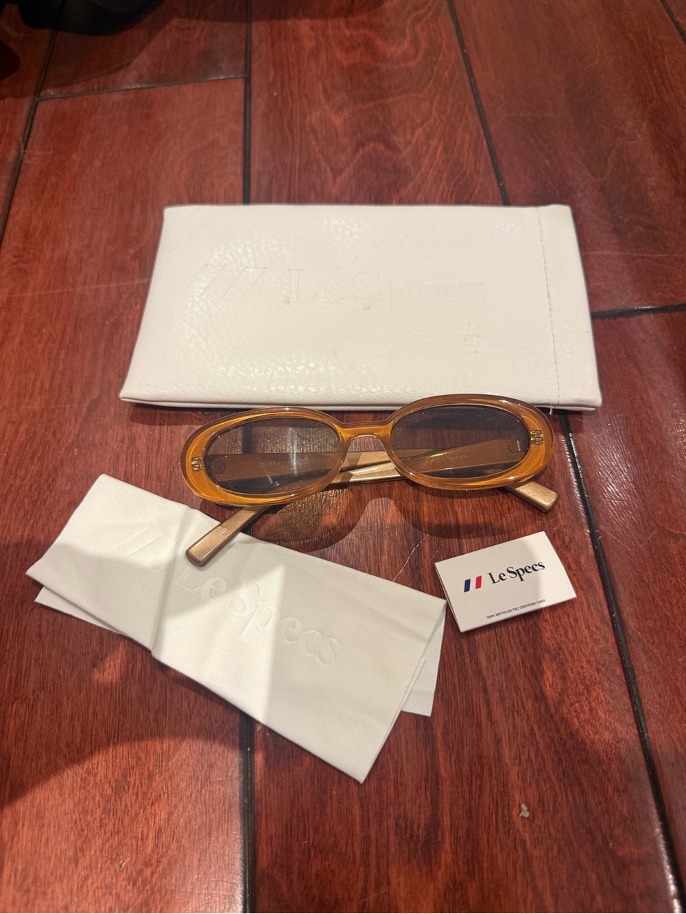 Le Specs Amber Oval Sunglasses with Brown Lenses